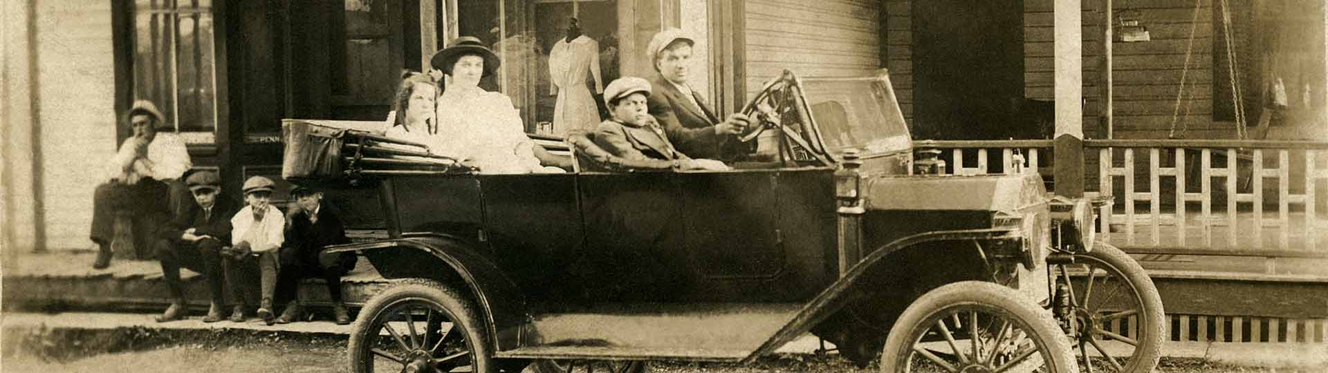 old photograph of car and people